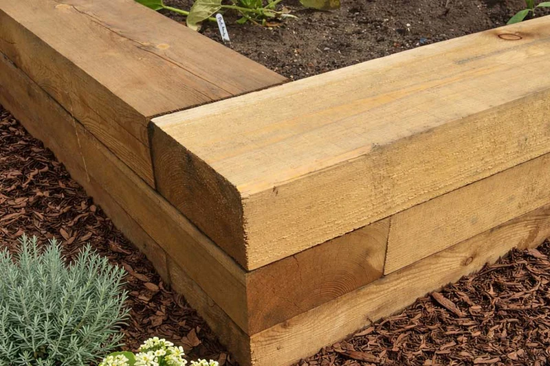 Stack of pressure-treated timber sleepers